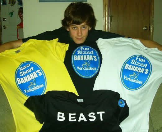 Josh holding up early Yorkalicious banana sticker tees and a BEAST tee